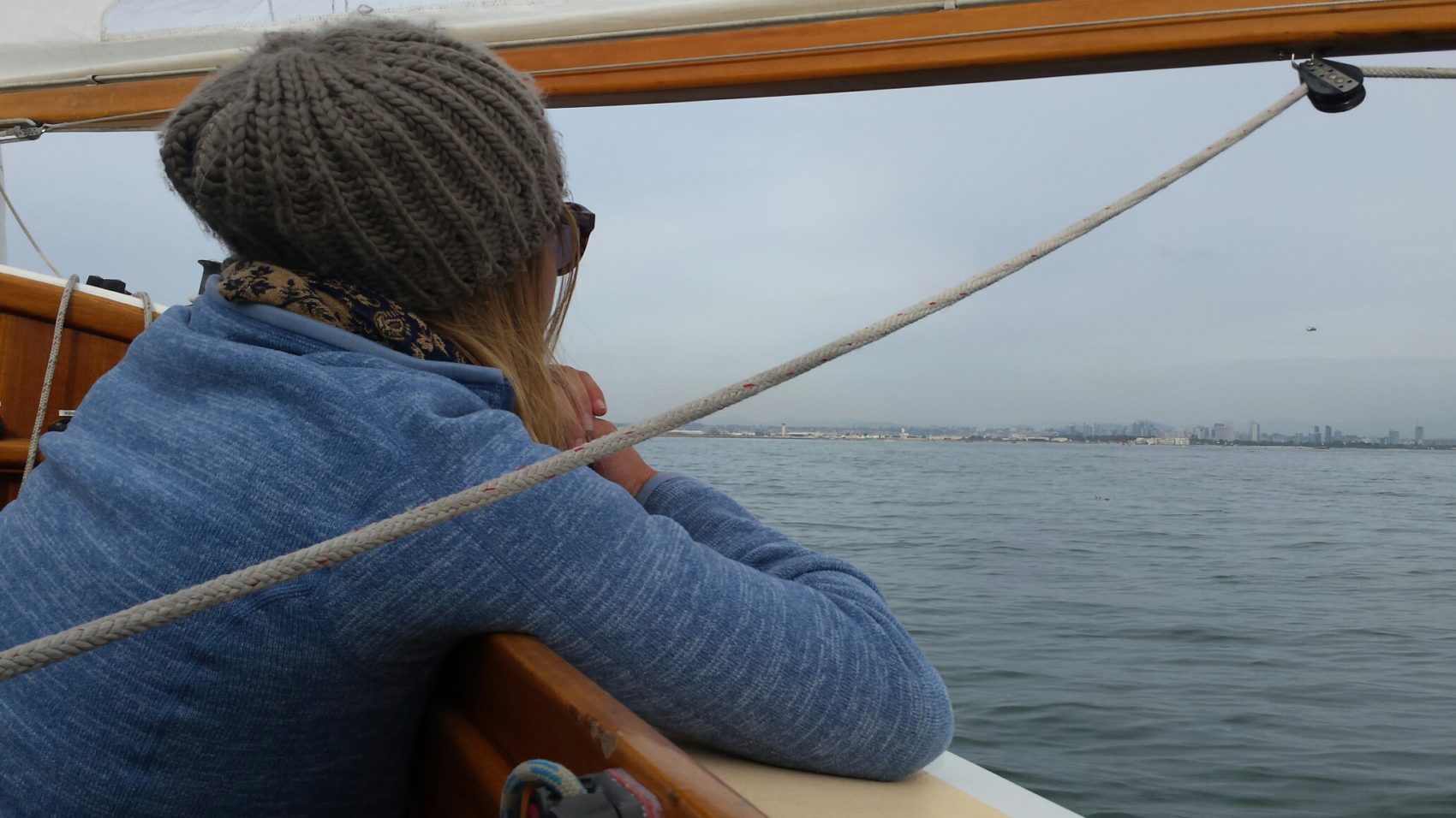 Mia looking at sea on a boat