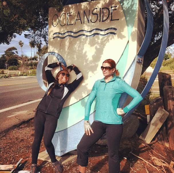 Jamie and Mia at Oceanside sign