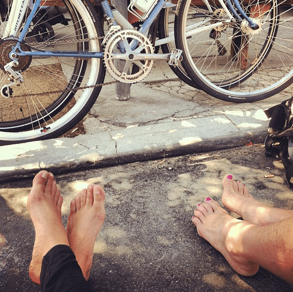 Bare feet next to bikes