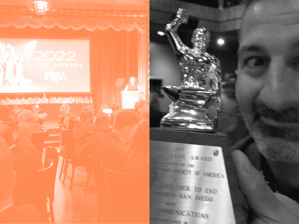 Karim holding Anvil Award trophy