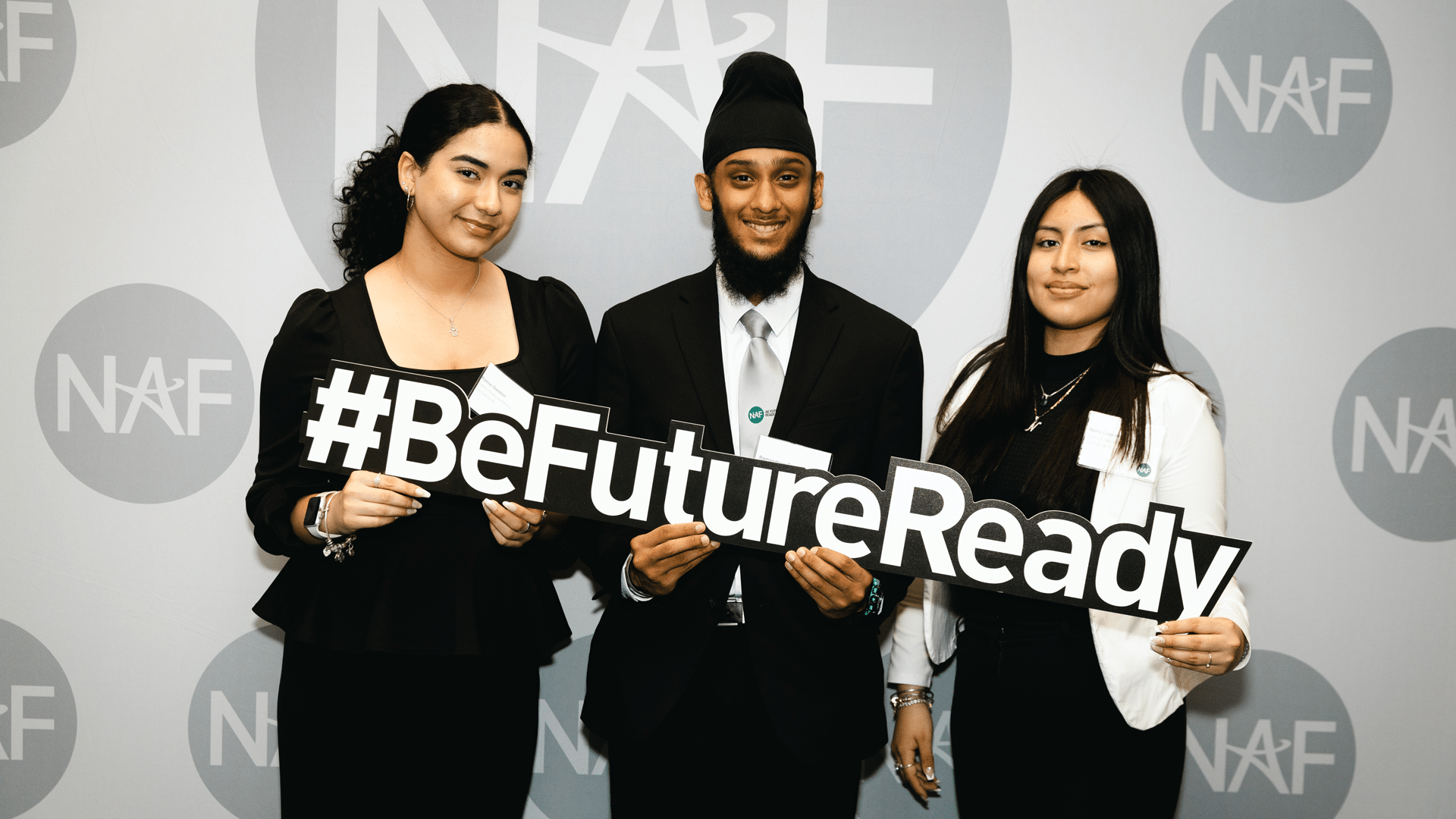 Youth at NAF event holding up sign that reads "#BeFutureReady"