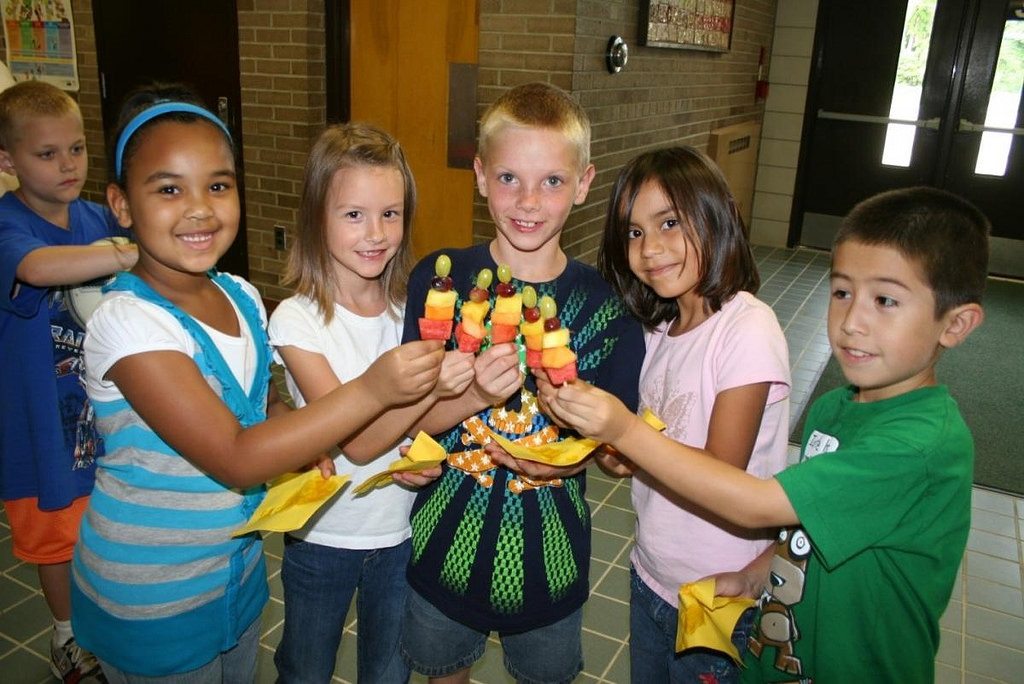 Children holding fruit