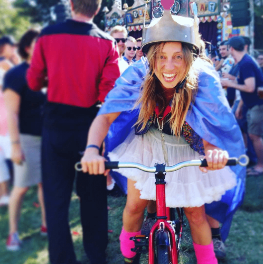 Mia riding bike at festival