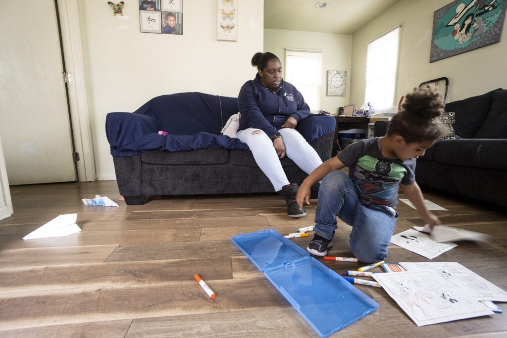 Mom and child coloring at home