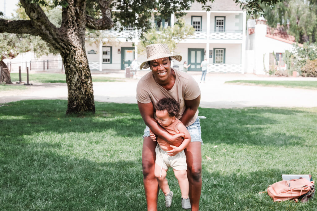 Child and adult playing at Old Town Historic Park