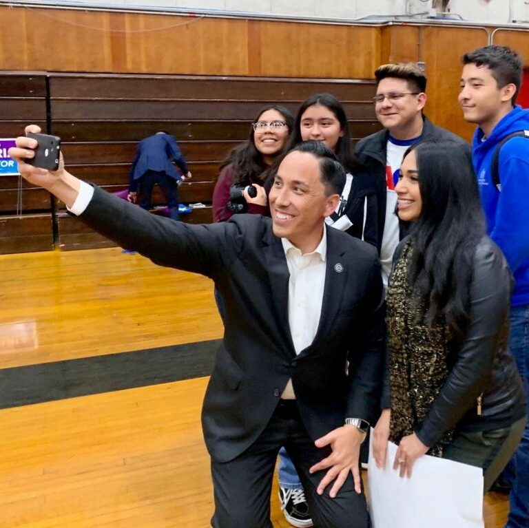 Major Todd Gloria taking selfie with youth