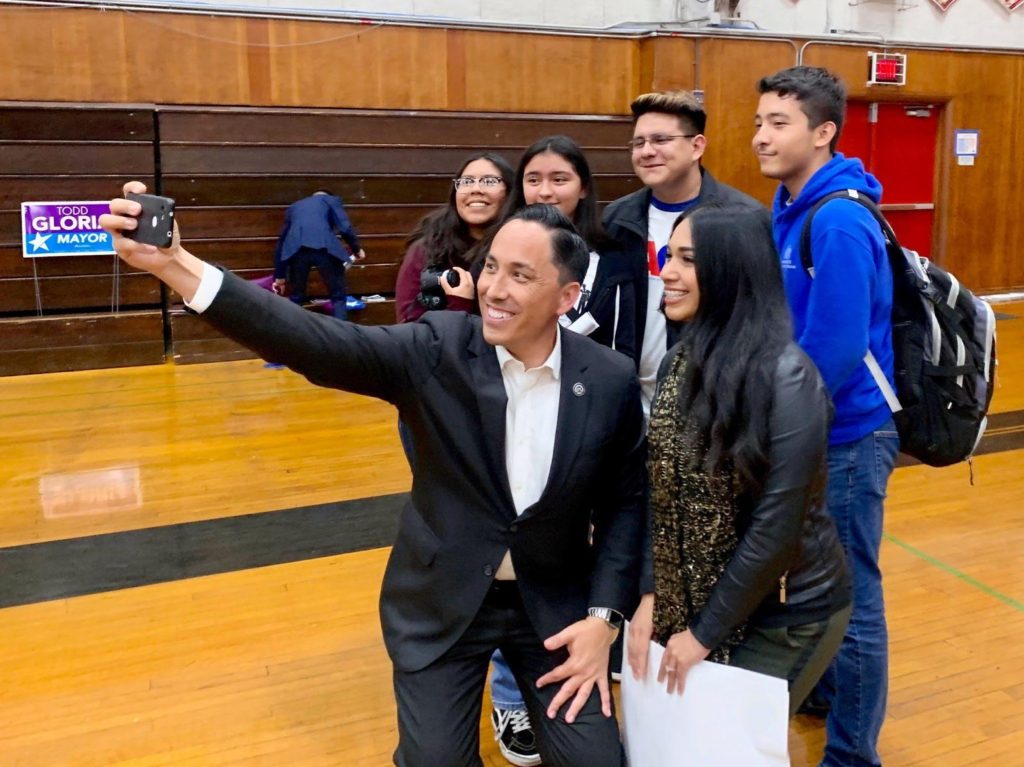 Major Todd Gloria taking selfie with youth